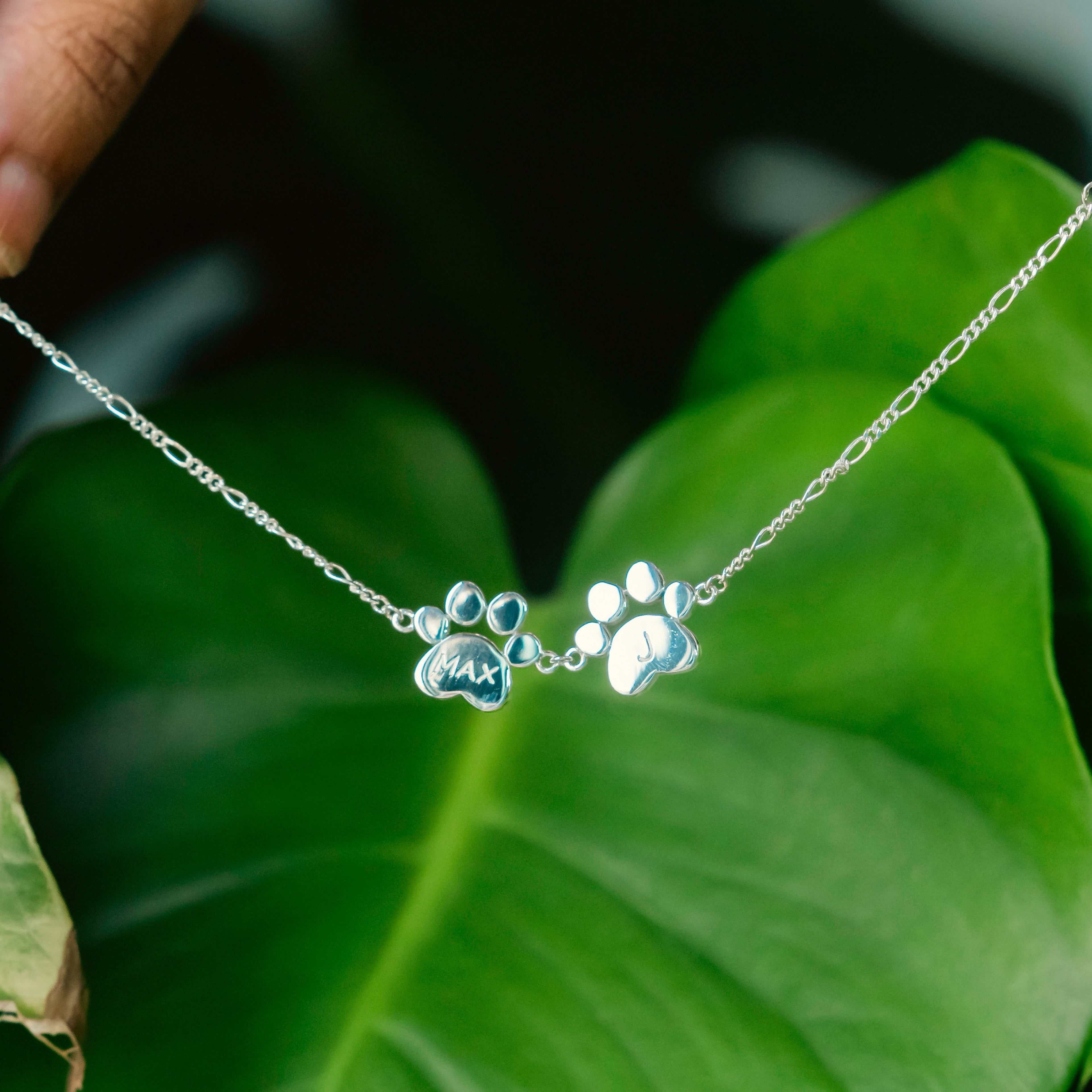 Bracelet with 2 paw shaped charms in silver