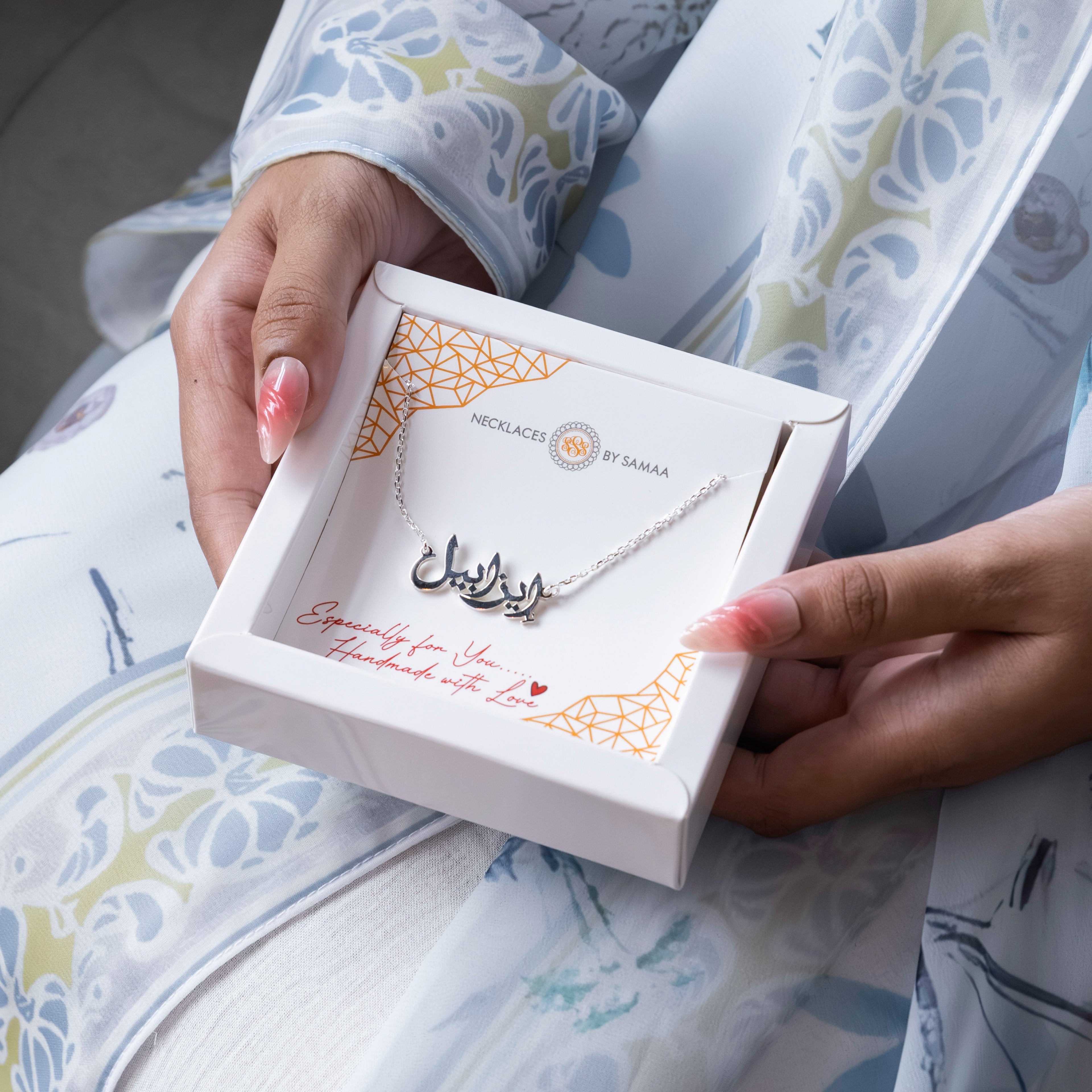 Silver arabic name necklace in a gift box in dubai
