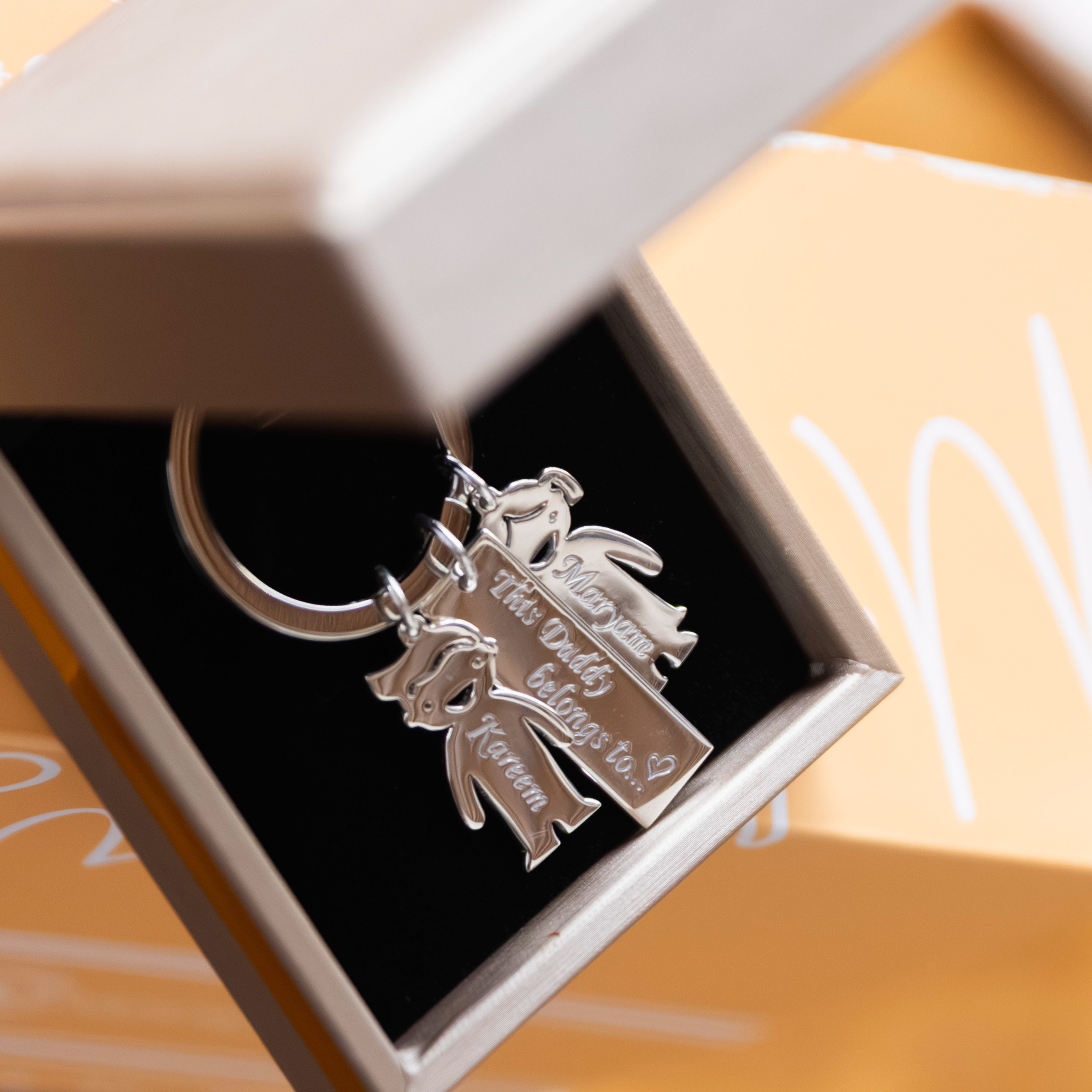 Silver key rings with boy and girl charm for father