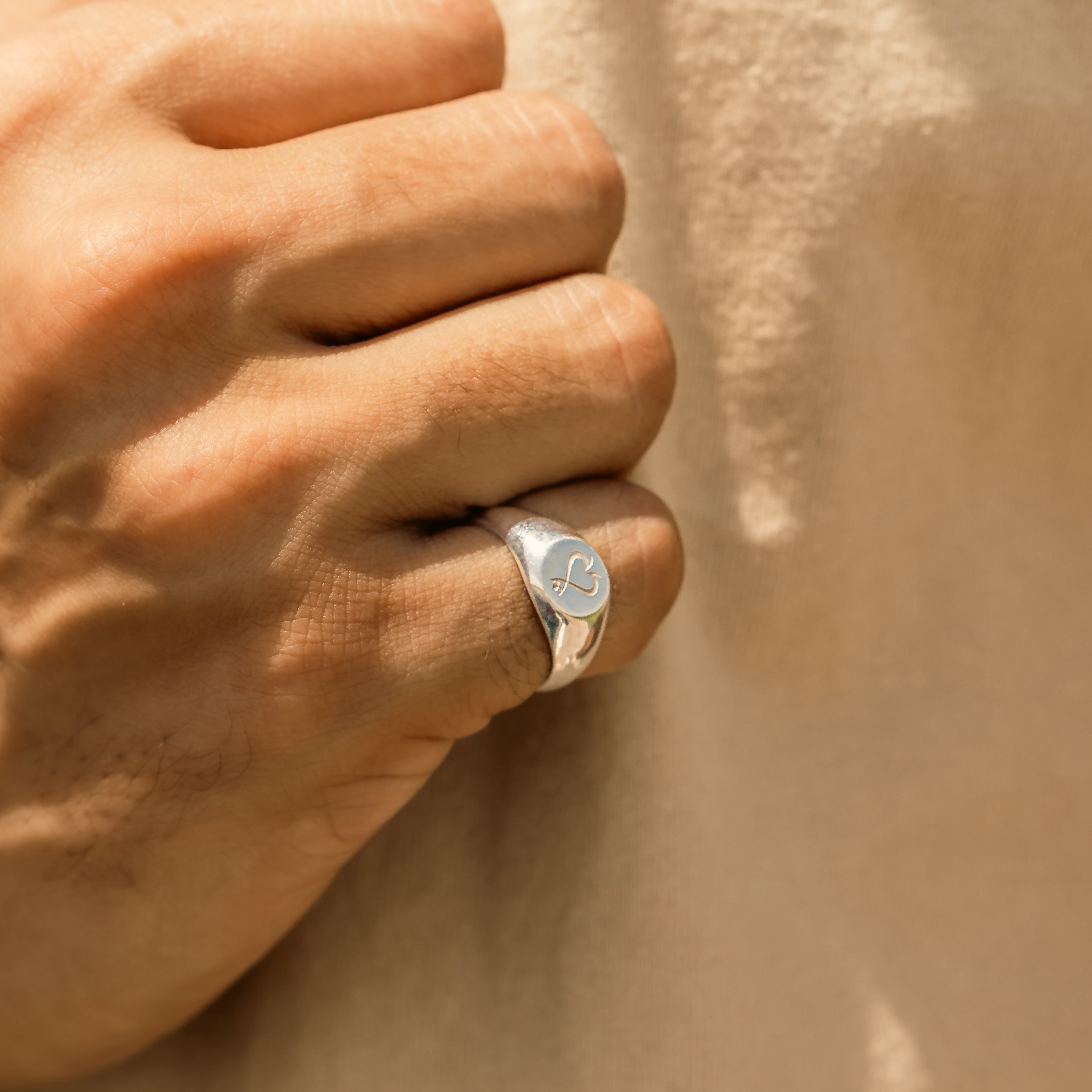 Men round shape signet ring with symbol in dubai abu dhabi