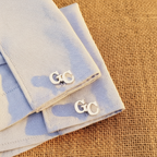 cufflinks with initials on a light Bluer shirt in dubai